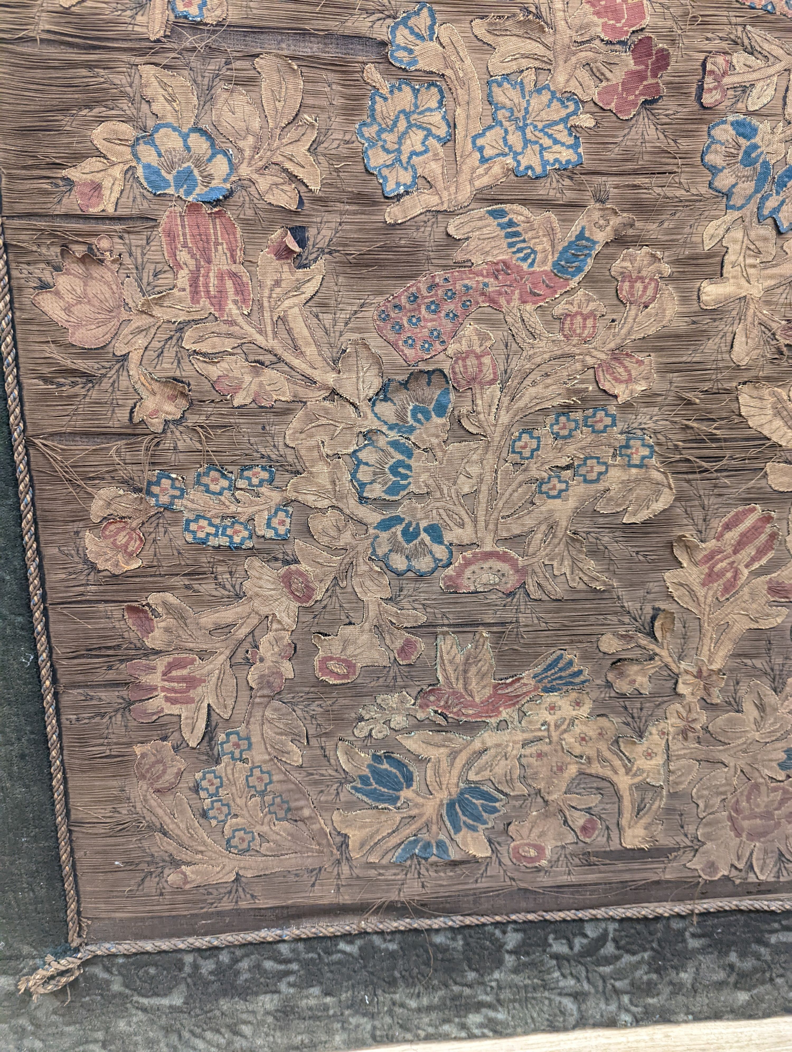 A Charles II applique work ‘tree of life’ picture, 102 x 72cm incl. cut velvet edge